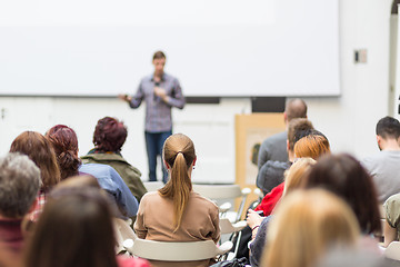 Image showing Man giving presentation in lecture hall at university.