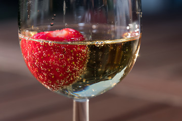 Image showing Strawberry in a glass sparkling wine close up