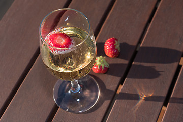Image showing Sparkling wine with strawberry closeup