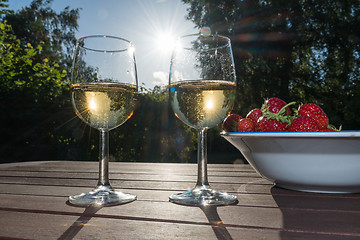 Image showing Backlit glasses with sparkling wine