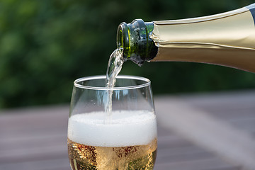 Image showing Pouring sparkling wine in a glass