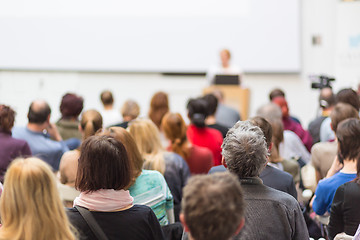 Image showing Woman giving presentation in lecture hall at university.