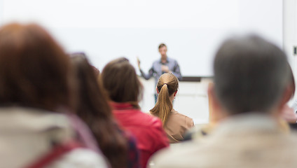 Image showing Man giving presentation in lecture hall at university.