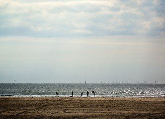 Image showing Surfers On Beach 