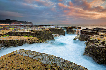 Image showing Sunrise  from the eroded rocky channel at North Narrabeen