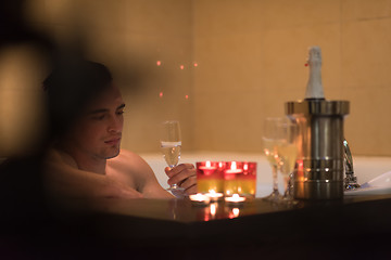 Image showing man relaxing in the jacuzzi