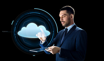 Image showing businessman with tablet pc and cloud projection