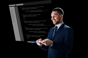 Image showing businessman with tablet pc and virtual coding