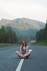 Image showing Woman sitting on the road
