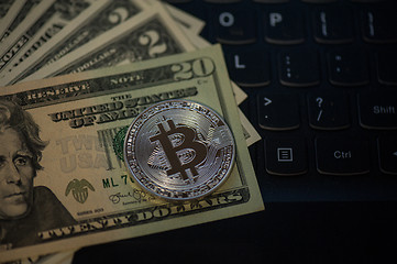 Image showing Bitcoin coin with dollars