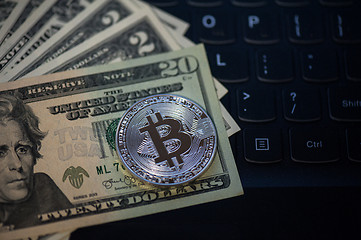 Image showing Bitcoin coin with dollars