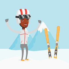 Image showing Cheerful skier standing with raised hands.