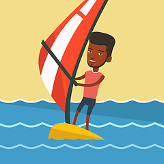 Image showing Young man windsurfing in the sea.