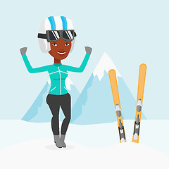 Image showing Cheerful skier standing with raised hands.