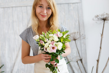 Image showing Portrait of florist with bouquet