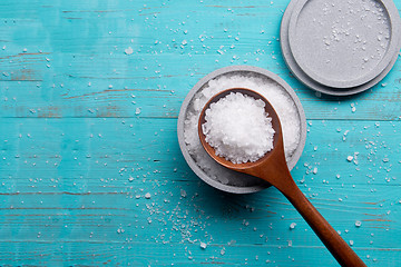 Image showing sea salt in stone bowl and wooden spoon