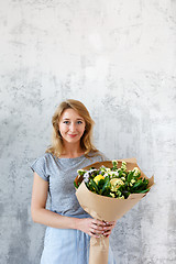 Image showing Long-haired florist on empty background