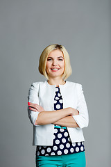 Image showing Smiling woman with arms crossed