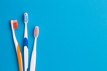 Image showing Colorful toothbrushes , space for text