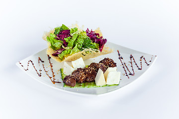 Image showing Close Up of Rack of Saucy Barbecue Pork Served on Plate in Restaurant