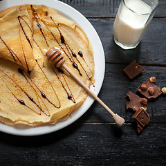 Image showing Stack of tasty pancakes with butter and honey for breakfast