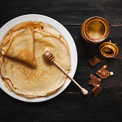 Image showing Stack of tasty pancakes with butter and honey for breakfast