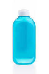 Image showing The blue plastic bottle with blue empty label isolated on white