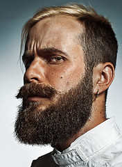 Image showing Portrait of hipster bearded man\'s side face.