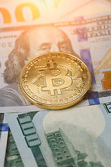 Image showing Image of dollars with golden bitcoin,