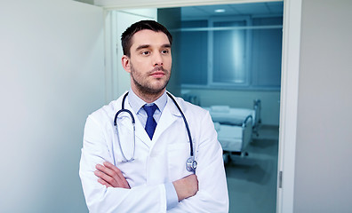 Image showing doctor with stethoscope at hospital corridor