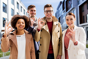 Image showing international business team showing ok hand sign