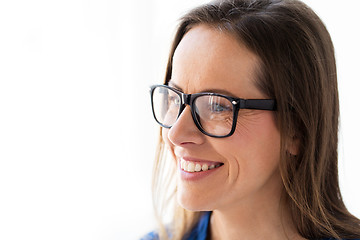Image showing close up of smiling middle aged woman in glasses