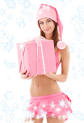 Image showing santa helper girl in pink with gift box