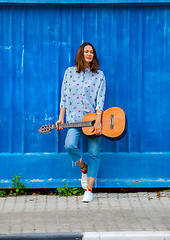 Image showing fashion. Beautiful woman with a guitar