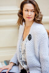 Image showing beautiful woman in a light blue knitted coat