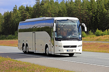 Image showing White Volvo Bus on Summer Freeway