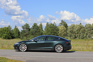 Image showing Metallic Green Tesla Model S on Summer Road