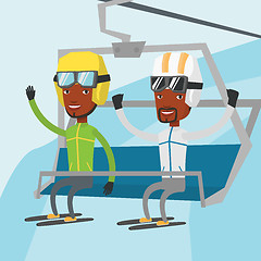 Image showing Two happy skiers using cableway at ski resort.