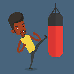 Image showing Man exercising with punching bag.