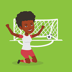 Image showing Soccer player celebrating scoring goal.