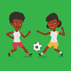 Image showing Two female soccer players fighting for ball.