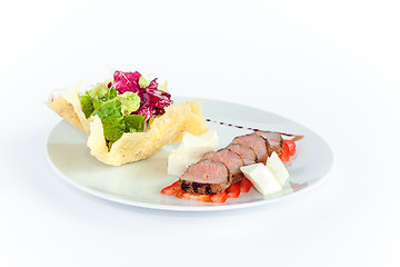 Image showing Close Up of Rack of Saucy Barbecue Pork Served on Plate in Restaurant