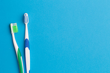 Image showing Colorful toothbrushes , place for inscription