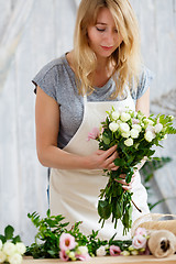 Image showing Portrait of blonde with bouquet