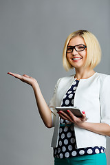 Image showing Girl with smartphone holds palm