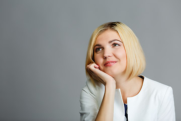 Image showing Girl with hand under chin