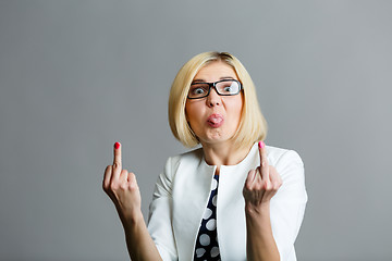 Image showing Girl shows tongue and finger