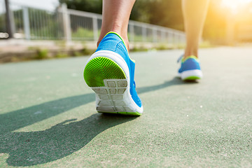 Image showing Woman training to run in a city