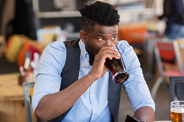 Image showing man drinking draught beer at bar or pub