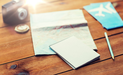 Image showing close up of notepad with map and travel tickets